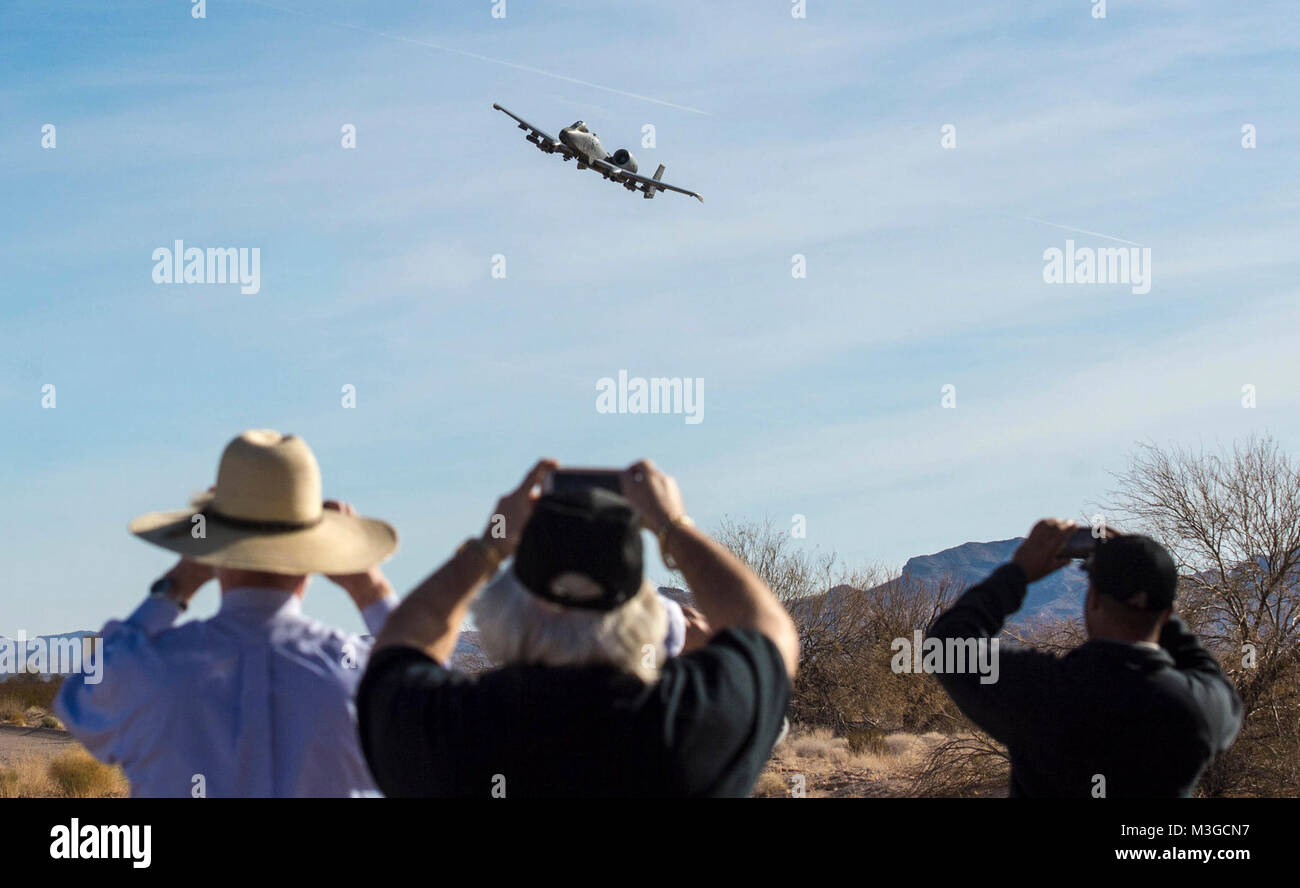 Spectators watch as an A-10 Thunderbolt II flies over the Barry M. Goldwater Range in Gila Bend, Ariz., Feb. 1, 2018. Airspace over Luke Air Force Base as well as the BMGR was used for pilots to contest with one another in basic fighter maneuvers and air-to-surface attacks in an annual competition known as Haboob Havoc. (U.S. Air Force Stock Photo