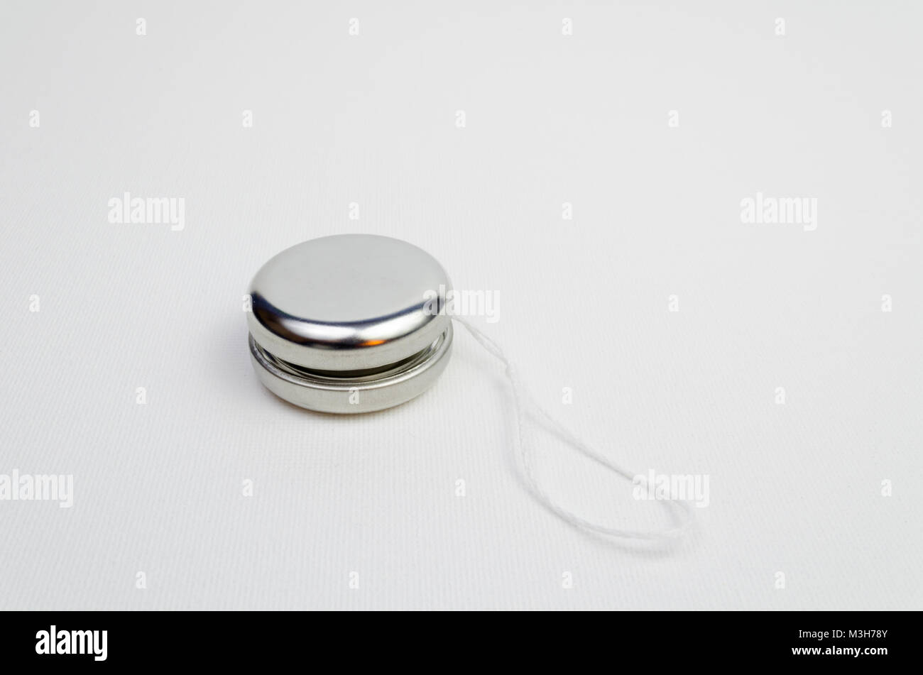 A Studio Photograph of a Silver Coloured Yoyo Stock Photo Alamy