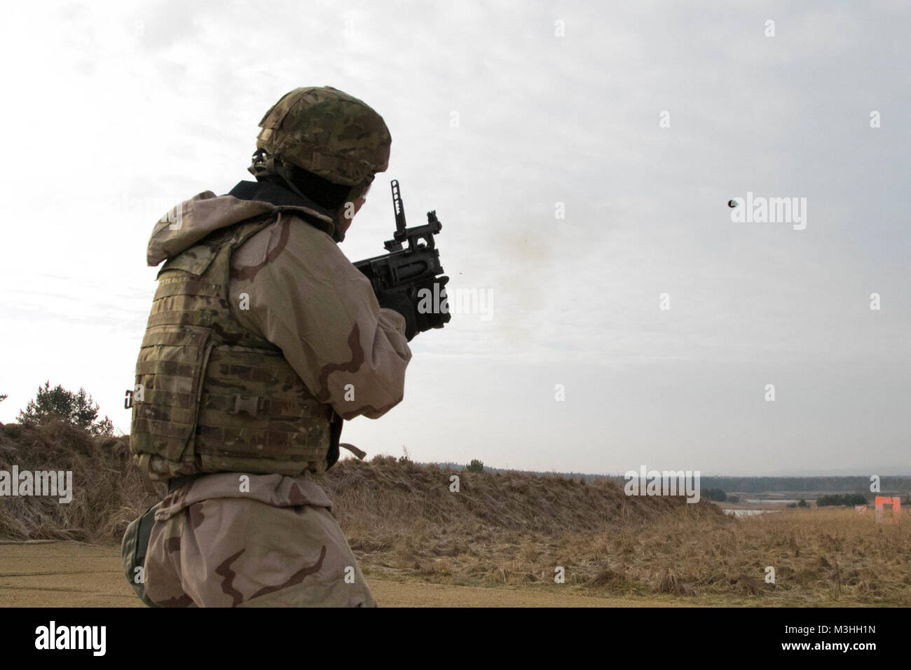 A U.S. Soldier assigned to 5th Squadron, 4th Cavalry Regiment, 2nd Armored Brigade Combat Team, 1st Infantry Division, Fort Riley, Kansas shoots an M320 grenade launcher during training at Grafenwoehr Training Area, Germany, Feb. 6, 2018.  The training with the grenade launcher was part of a training session that included other various tasks, such as familiarization with U.S. military weapons and defense against chemical and biological threats. (U.S. Army Stock Photo