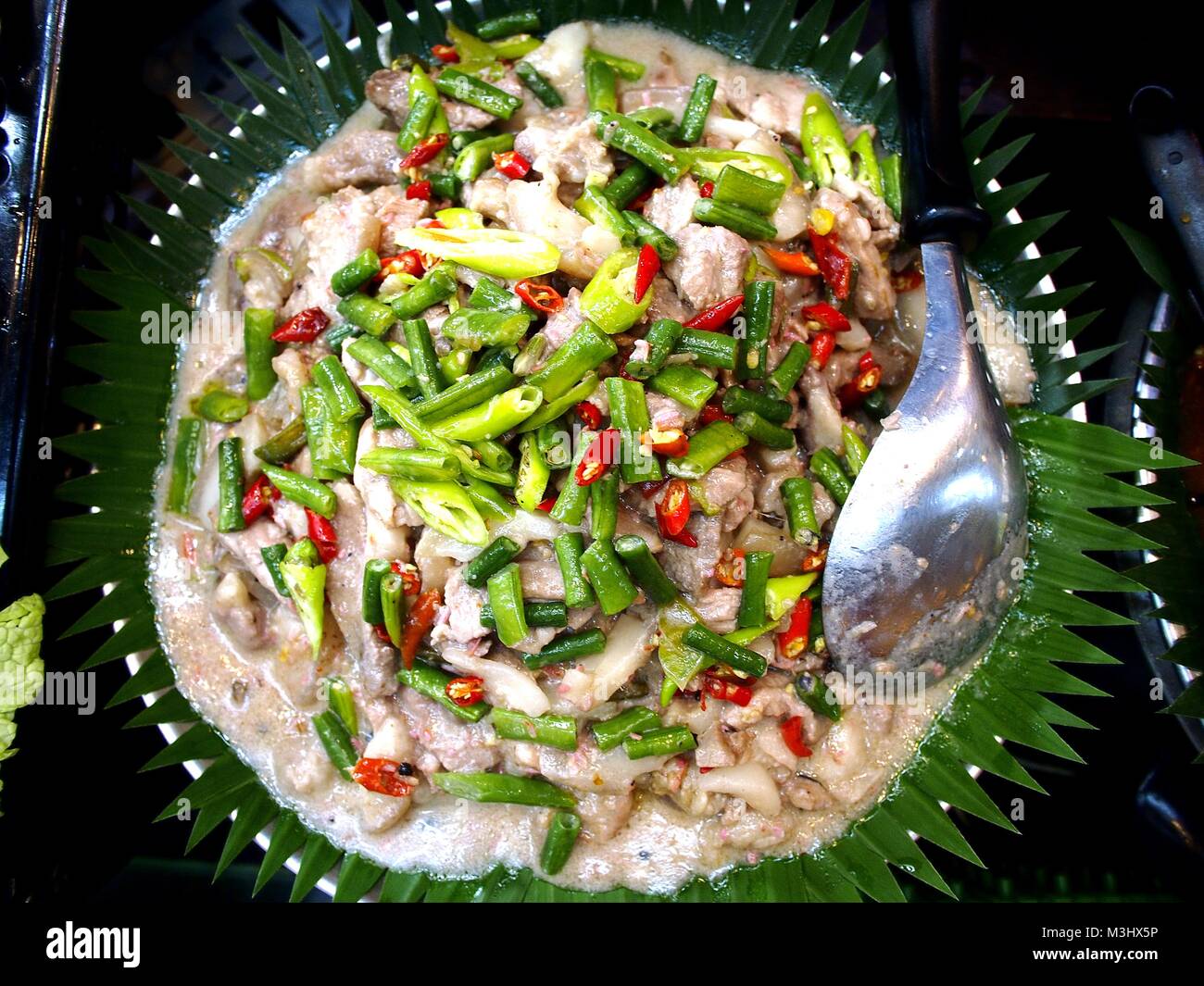 Photo of Filipino dish called Bicol Express or pork with string beans and green chili cooked in