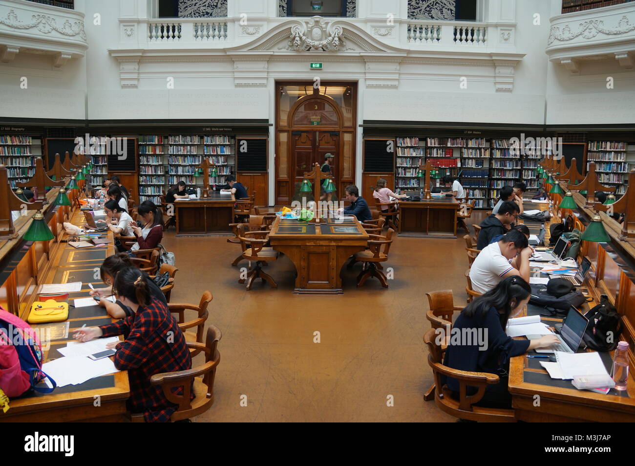 Studying people in the library Stock Photo - Alamy