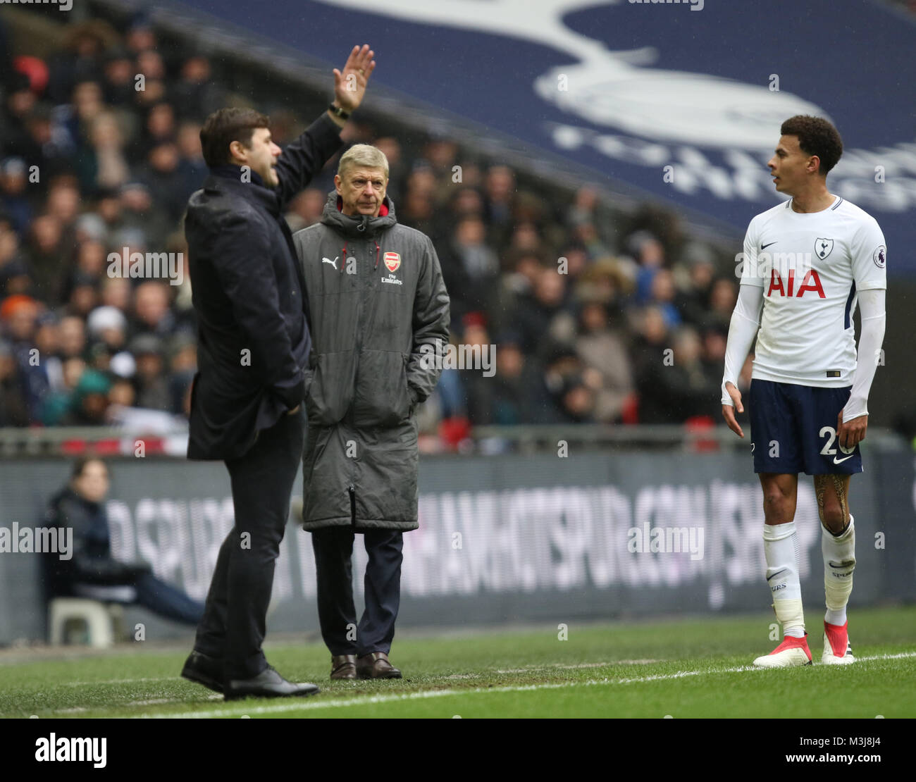 London, UK. 10th February, 2018. Arsene Wenger (Arsenal manager), behind Mauricio Pochettino (Spurs manager), looks at Dele Alli (TH) at the English Premier League football match between Tottenham Hotspur v Arsenal at Wembley Stadium, London, on February 10, 2018.  Credit: Paul Marriott/Alamy Live News Stock Photo