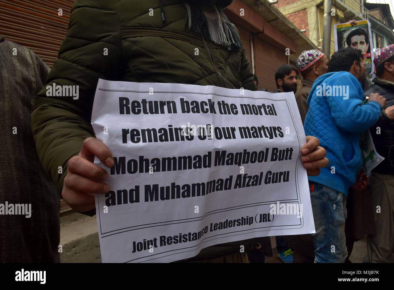 Srinagar, India. 11th Feb, 2018. A Kashmiri protester holds a placard ...