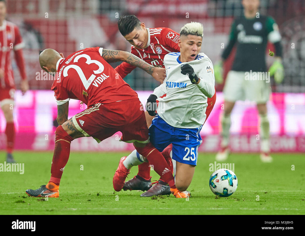 Munich, Germany. 10th February 2018. FC Bayern Munich Soccer, Munich, February 10, 2018 Amine HARIT, S04 Nr. 25  compete for the ball against  James RODRIGUEZ, FCB 11 Arturo VIDAL, FCB 23  FC BAYERN MUNICH - FC SCHALKE 04 2-1 1.German Soccer League , Munich, February 10, 2018,  Season 2017/2018 © Peter Schatz / Alamy Live News Stock Photo