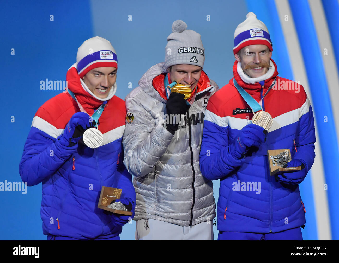 Pyeongchang, South Korea. 11th Feb, 2018. Champion Andreas Wellinger from Germany (C), second-placed Johann Andre Forfang (L) from Norway and third-placed Robert Johansson from Norway pose for photos during the medal ceremony of men's normal hill individual event of ski jumping at 2018 PyeongChang Winter Olympic Games at the Medal Plaza in PyeongChang, South Korea, on Feb. 11, 2018. Credit: Lui Siu Wai/Xinhua/Alamy Live News Stock Photo