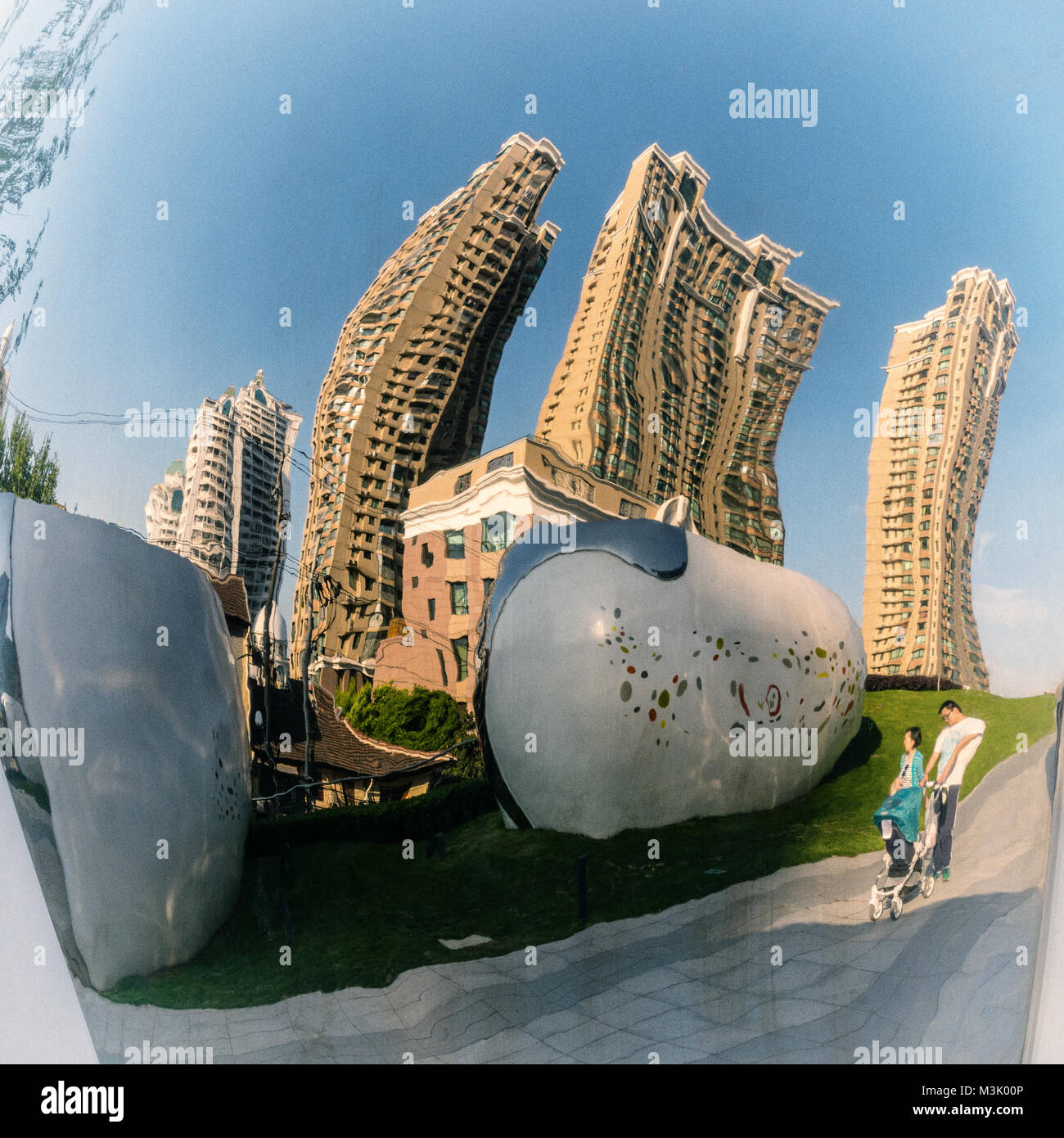 Distorted reflections in a parkside mirror in Shanghai, China Stock