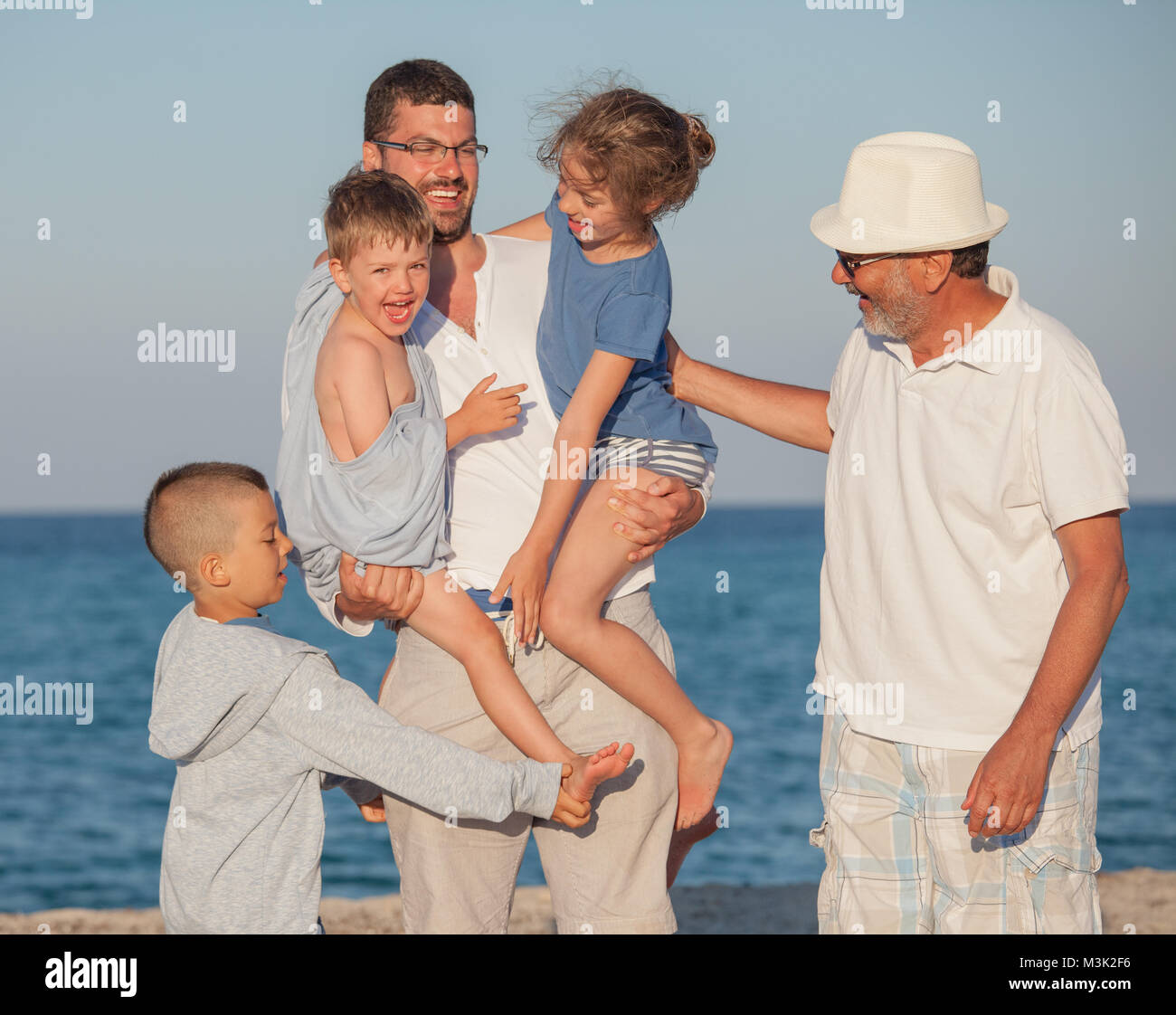 Happy Generations Family Sea Father Kids Grandfather Stock Photo