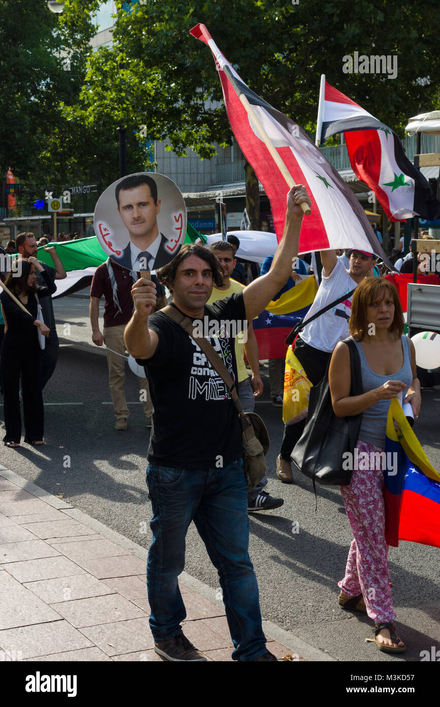 BERLIN, GERMANY - AUGUST 03, 2013: International Quds Day. A group of demonstrators supporting the policy of Syrian President Bashar Hafez al-Assad. Stock Photo