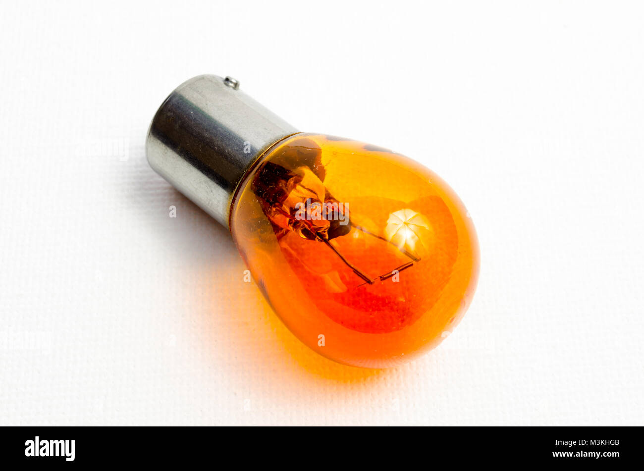 A Studio Photograph of an Orange Coloured Automotive Indicator Bulb
