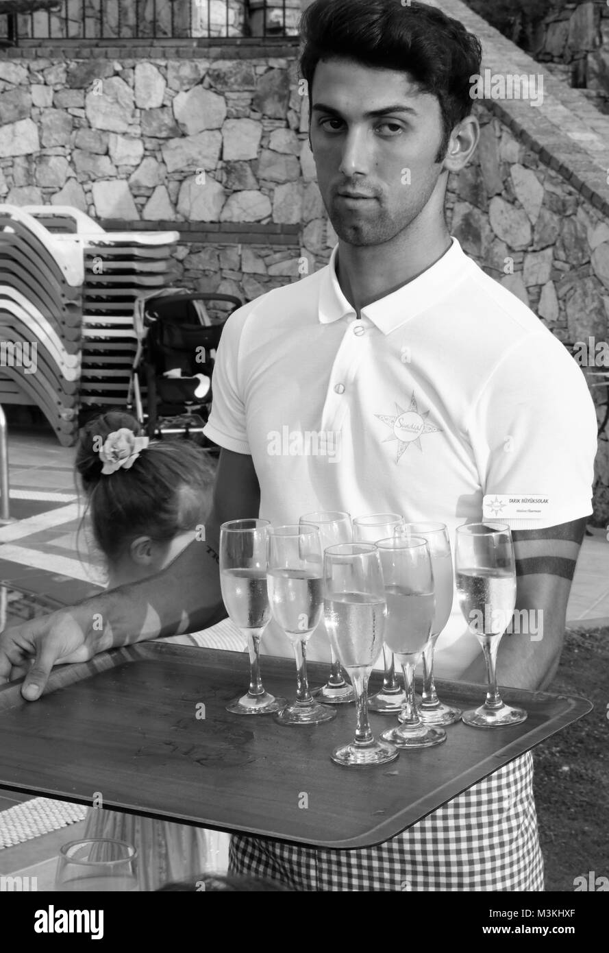 4TH AUGUST 2017, FETHIYE,TURKEY: An unknown waiter serving champagne at a wedding in Fethiye,Turkey,4th august 2017 Stock Photo