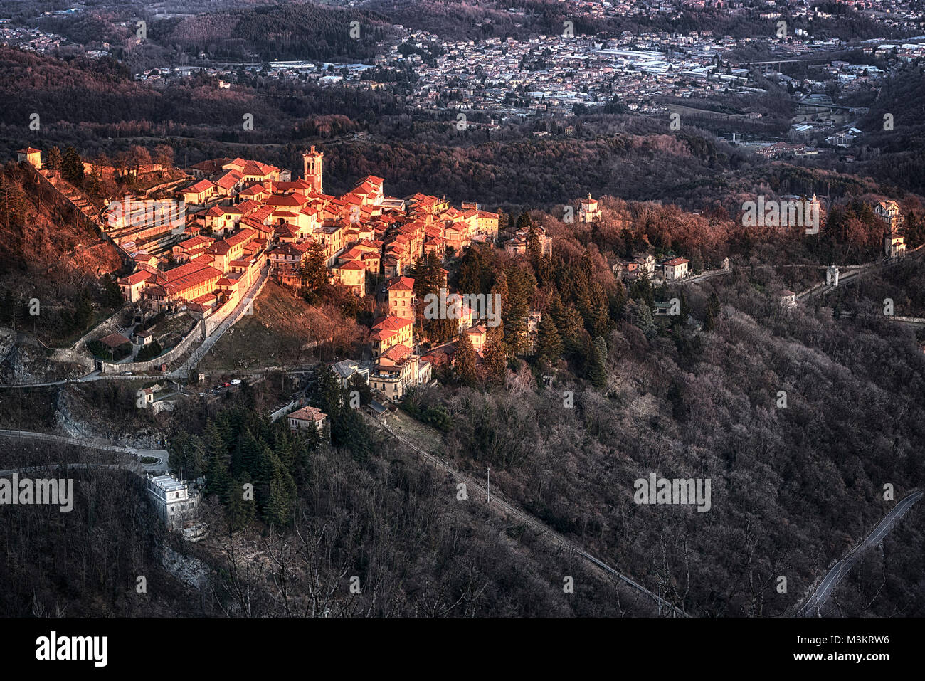 Warm sunny light on the ancient village of Sacred Mount of Varese in a winter afternoon Stock Photo
