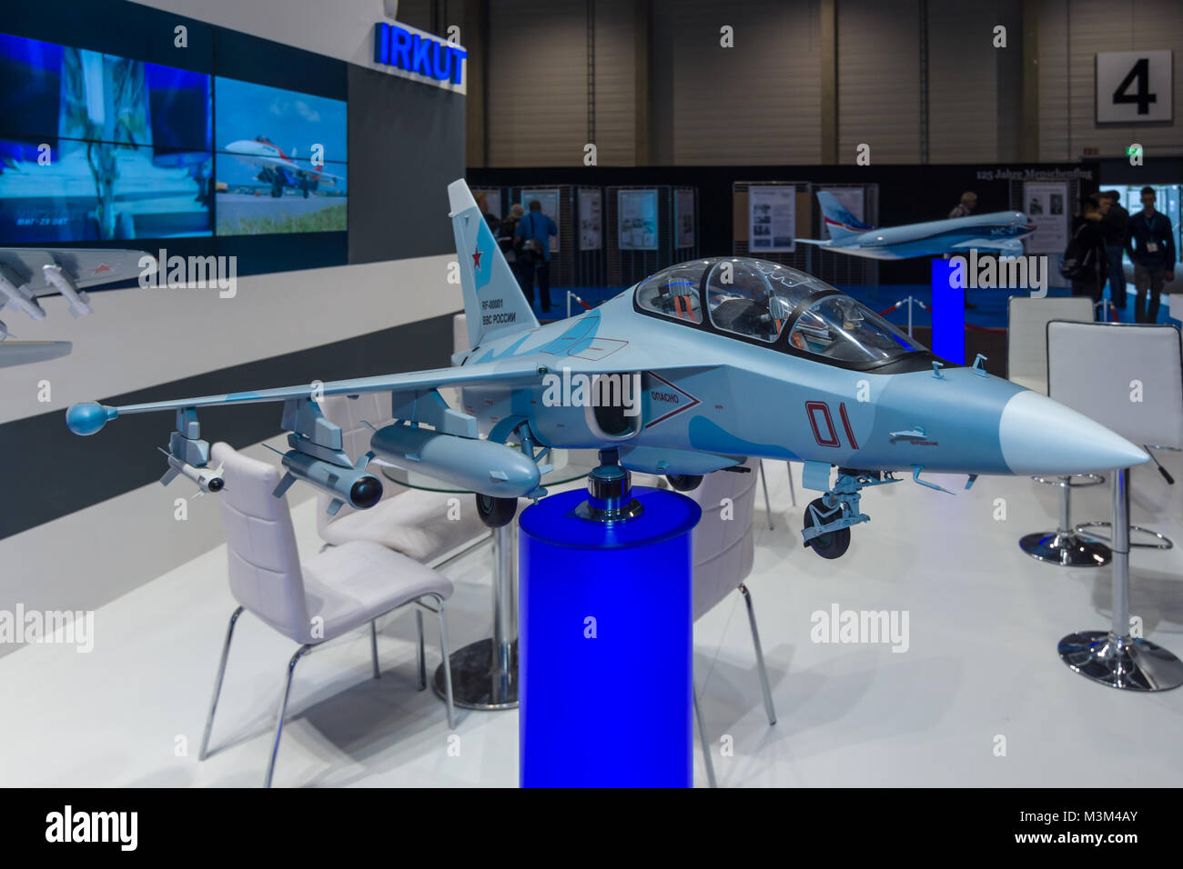 BERLIN, GERMANY - JUNE 01, 2016: The stand of Unated Aircraft Corporation (Russia). Model of Russian subsonic two-seat advanced jet trainer Yakovlev Yak-130. Exhibition ILA Berlin Air Show 2016 Stock Photo