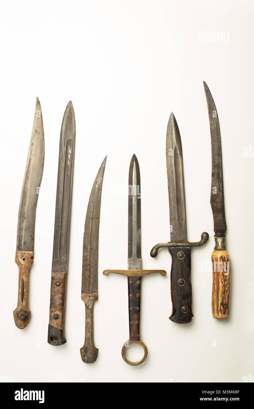 Collection of different vintage knives and daggers with a variety of shapes of blade and hilt or