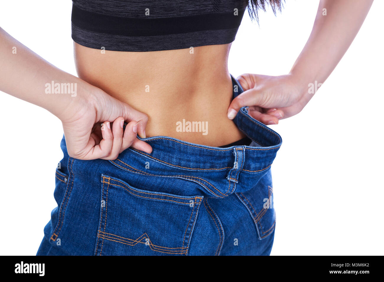 Woman loose jeans back hi-res stock photography and images - Alamy