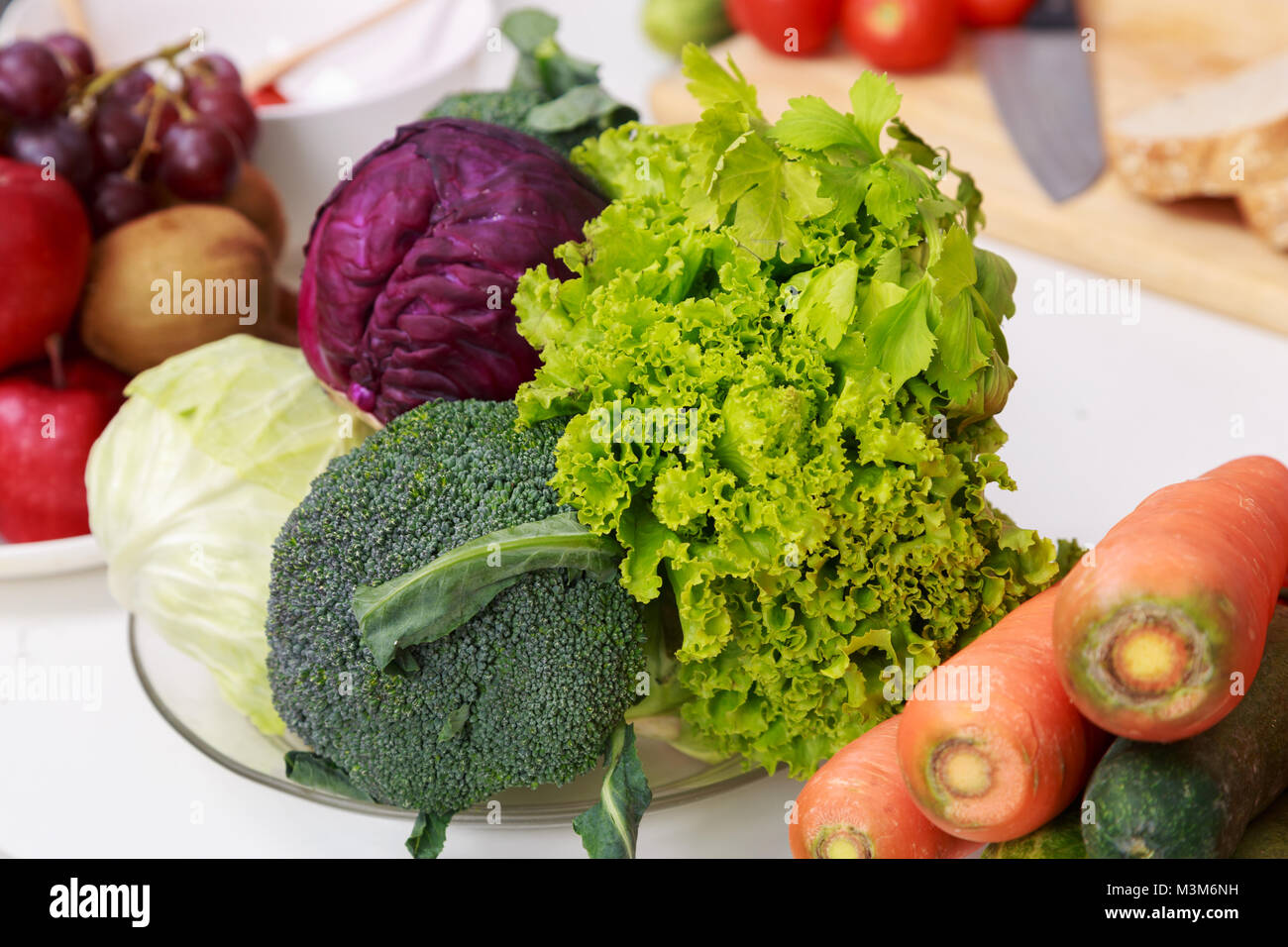 close up vegetables and fruit on kitchen table Stock Photo