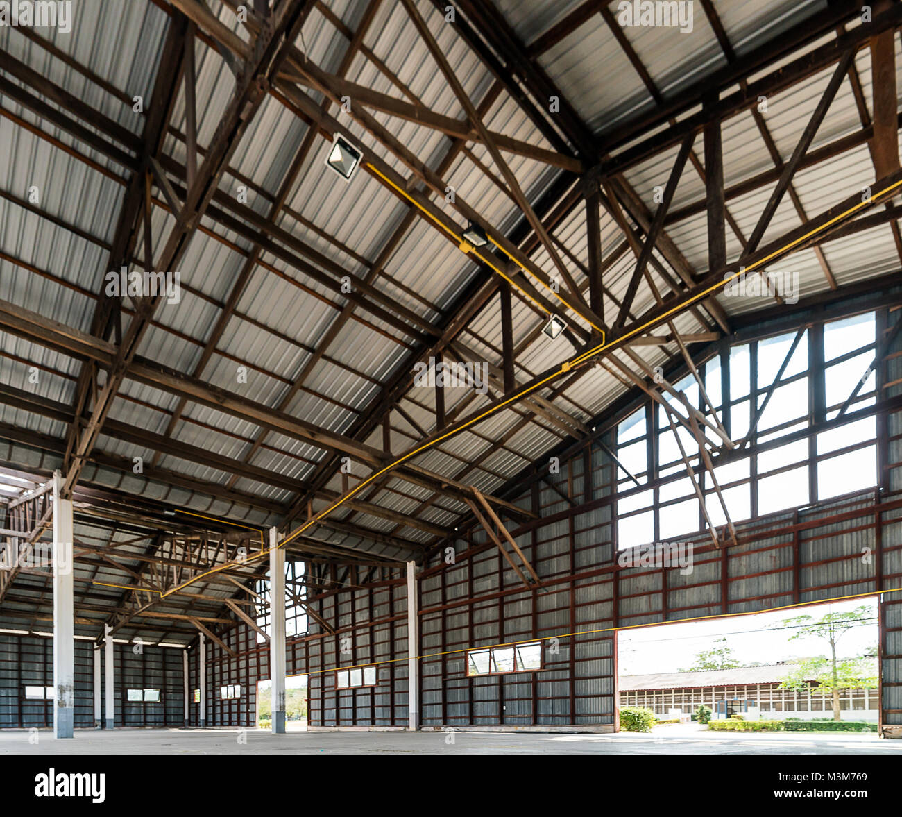 Empty old and rustic hangar building Stock Photo