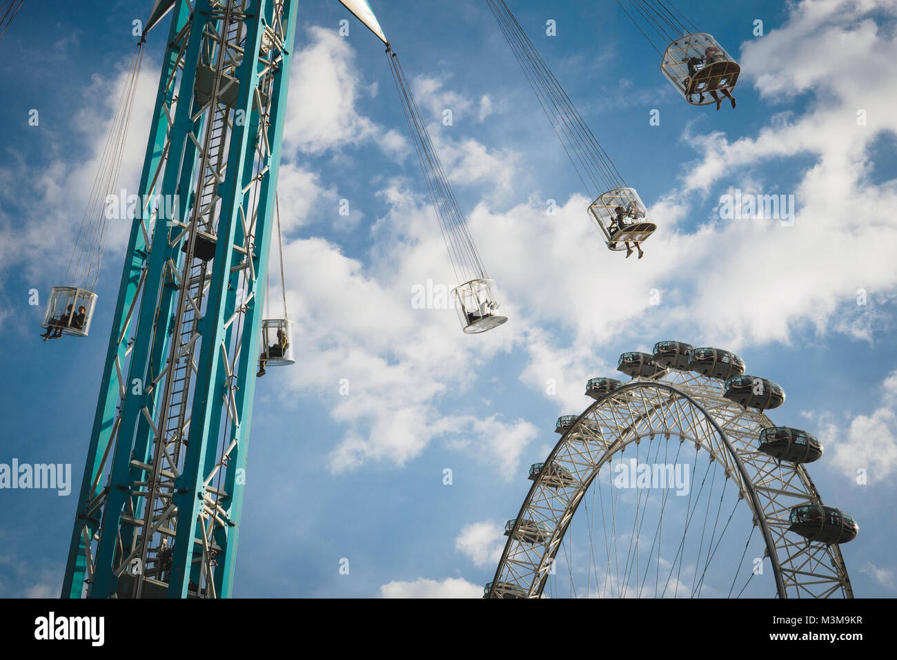 London (UK) - August 2017. Chair swing ride and the London Eye in South Bank near the Royal Festival hall. Landscape format. Stock Photo
