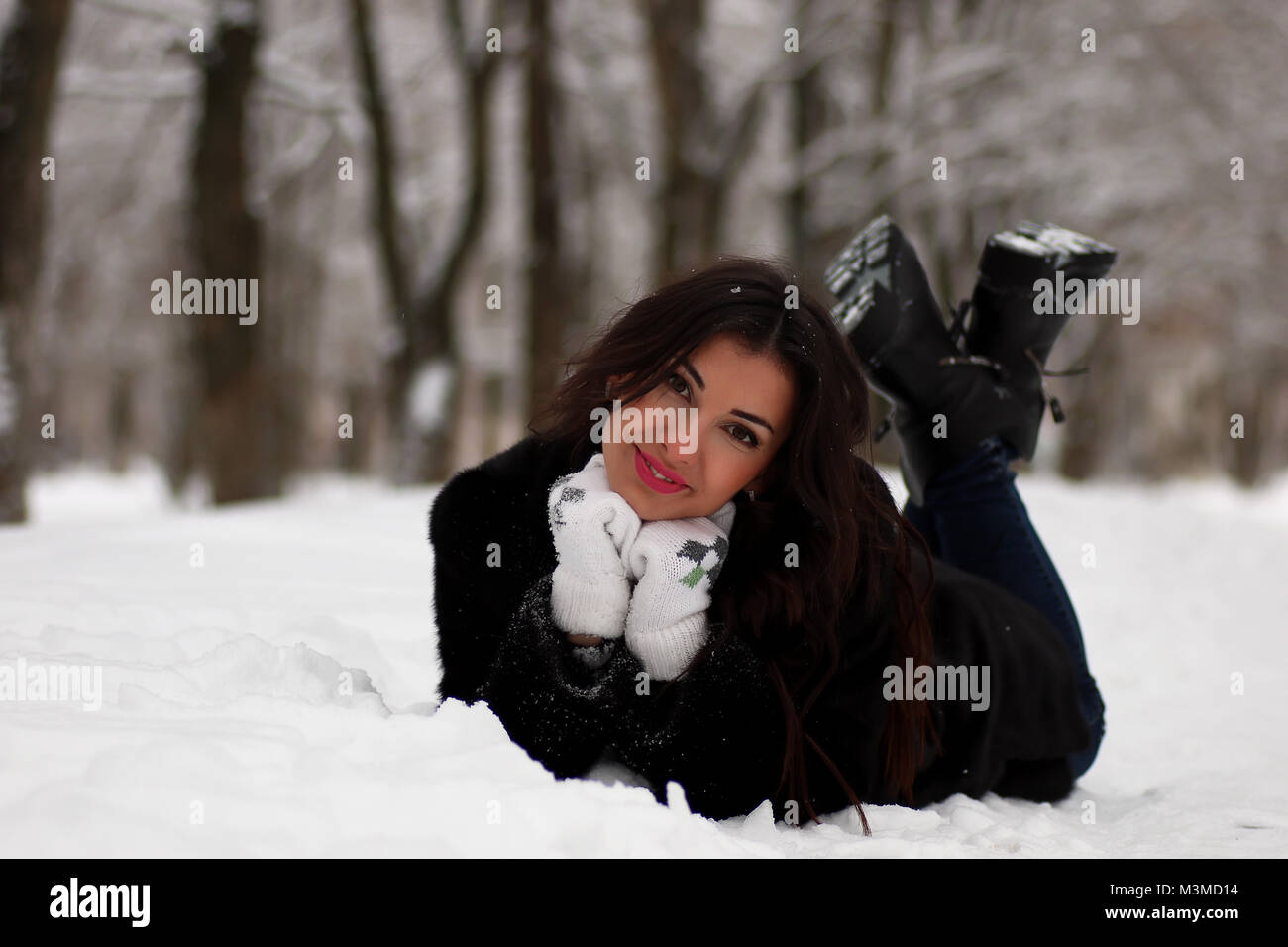 A young woman walk in a winter park Stock Photo - Alamy