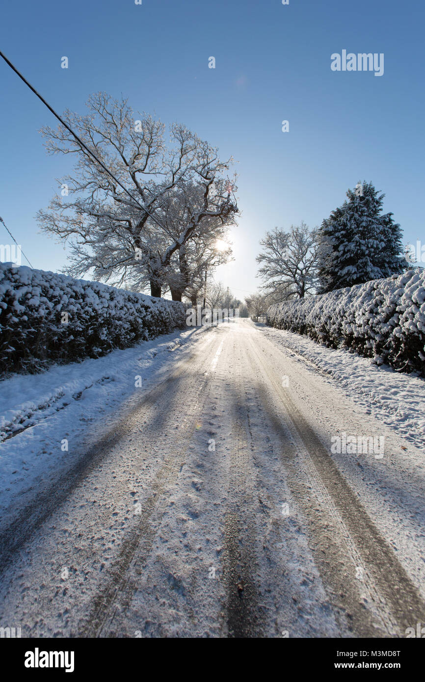 Winter England Rural Village of Coddington, England. Silhouetted winter view of a rural non ...