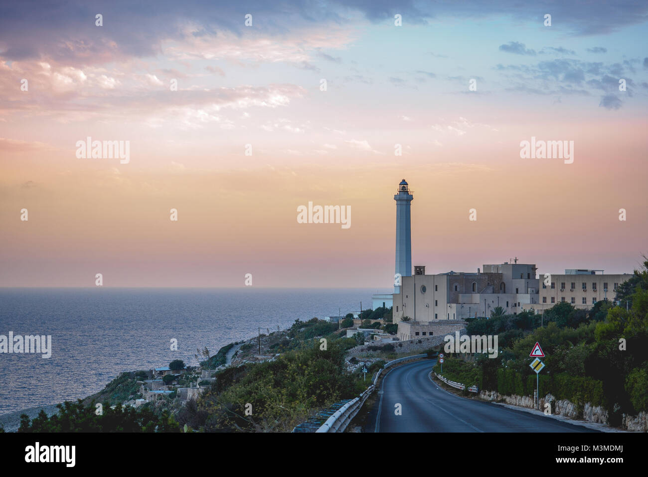 Santa Maria di Leuca (Italy), August 2017. View of the iconic lighthouse in Leuca, along the Apulian coast at sunset. Landscape format. Stock Photo