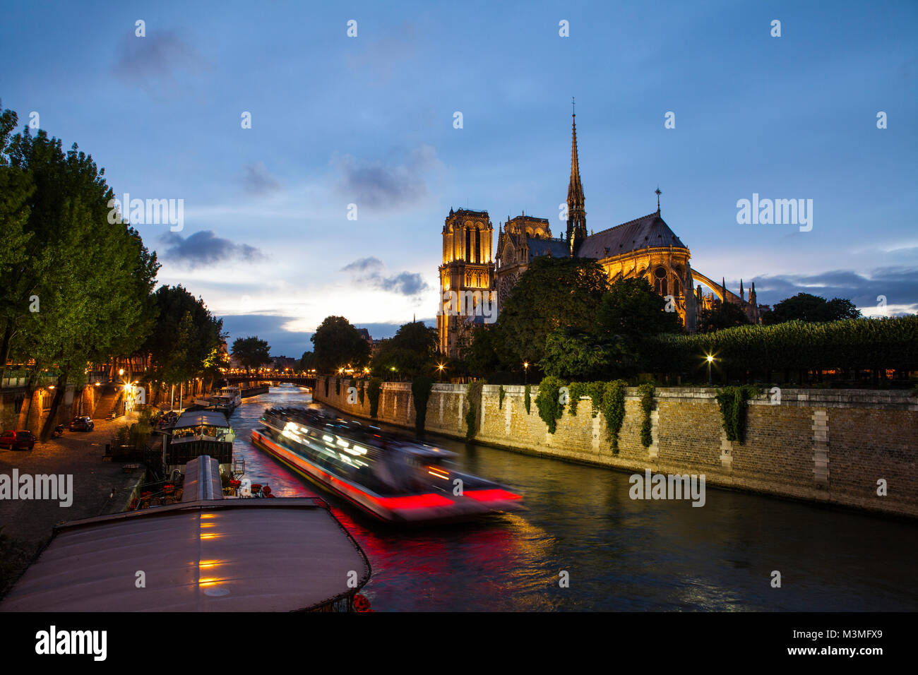 Notre Dame de Paris and Seine river at night Stock Photo