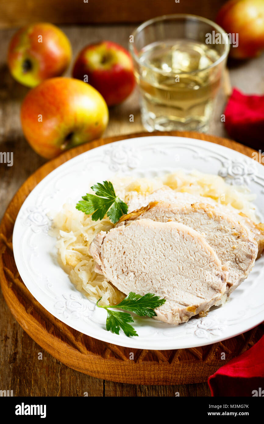 Pork, cooked with white wine and sauerkraut Stock Photo - Alamy