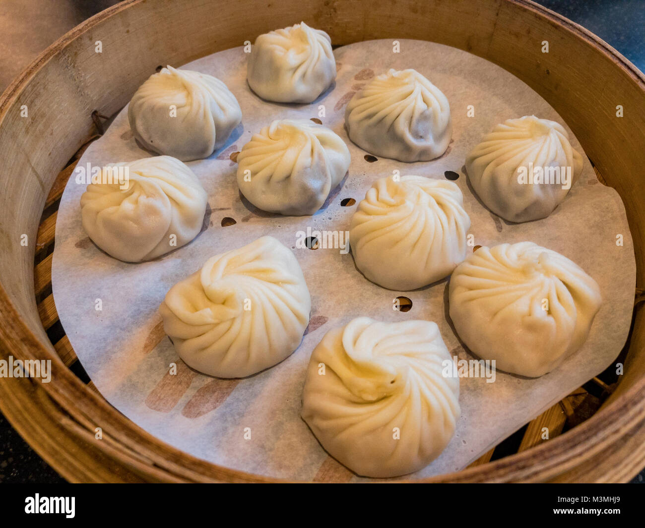 Soup Dumplings Steamed In Bamboo Steaming Baskets Ate At Din Tai Fung Los Angeles Stock Photo Alamy