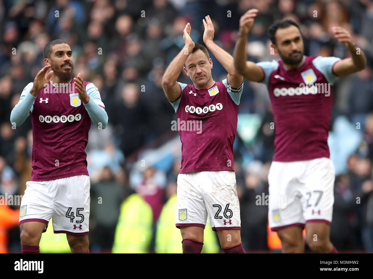 Aston Villa's John Terry (centre) Lewis Grabban and Ahmed Elmohamady applaud the fans after Aston Villa win 2- 0 during the Sky Bet Championship match at Villa Park, Birmingham. Stock Photo