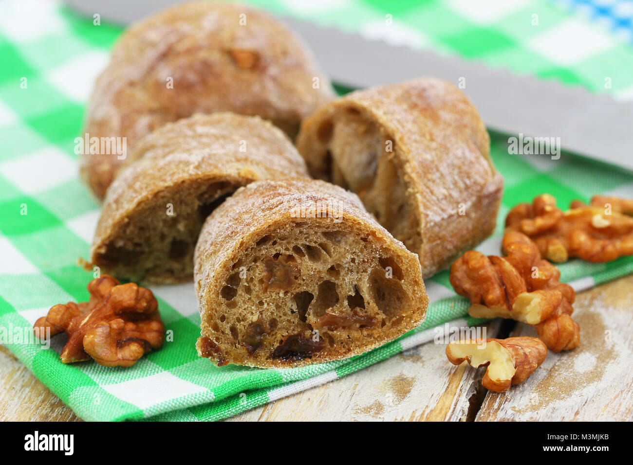 Slice of brown bread with walnuts and raisins, closeup Stock Photo Alamy