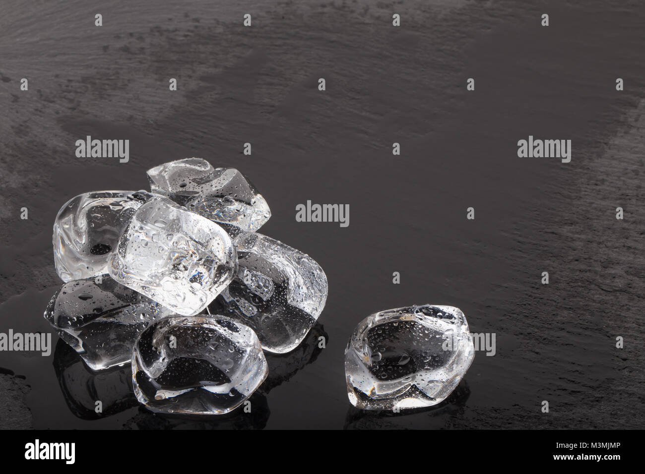 Ice cubes with drops of water on the black background Stock Photo - Alamy