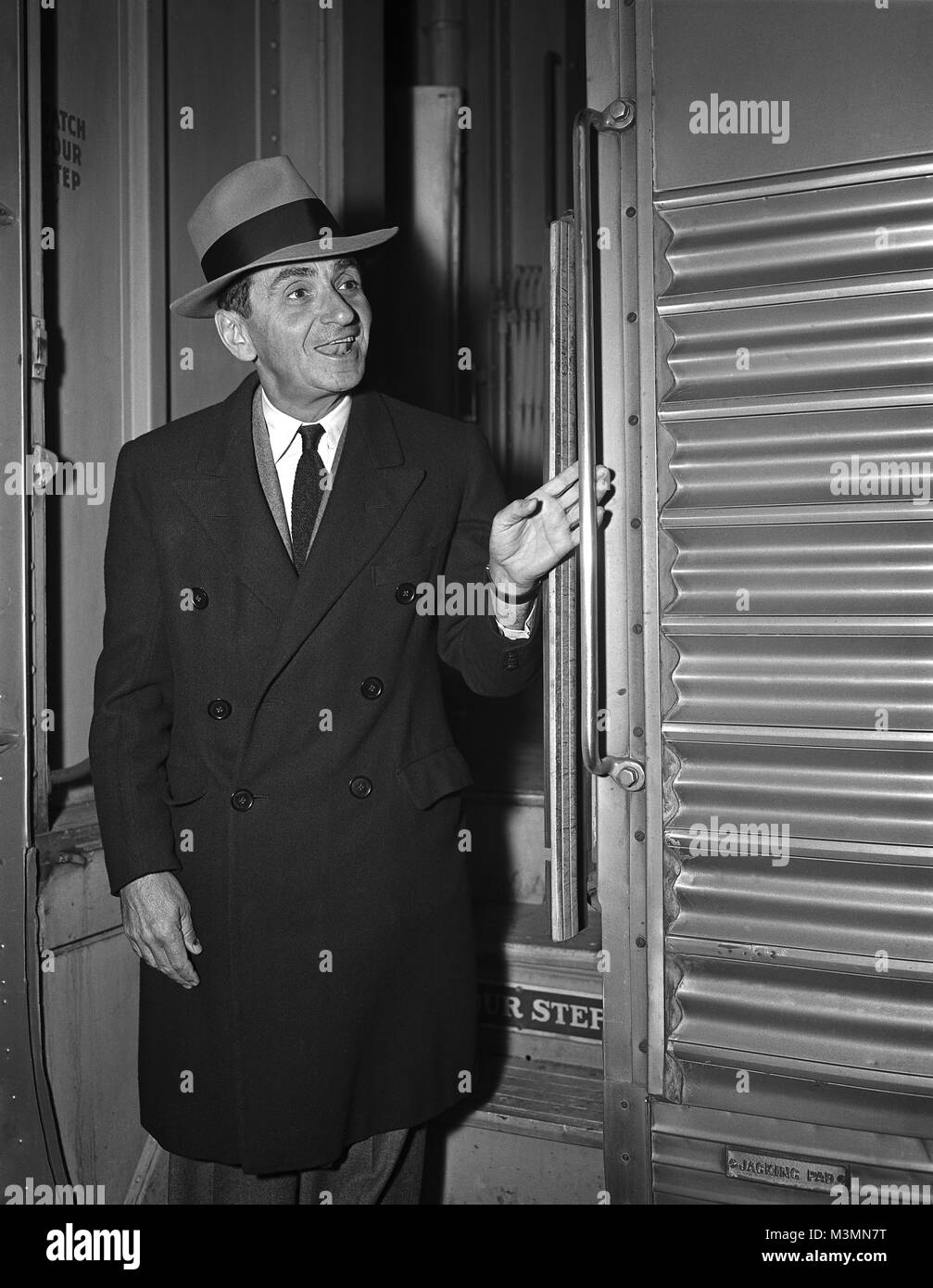 Songwriter Irving Berlin arriving on the Super Chief train in Chicago, IL.   November 4, 1945.  Berlin composer of many songs such as: White Christmas, Blue Skies and God Bless America. Original camera negative. Stock Photo