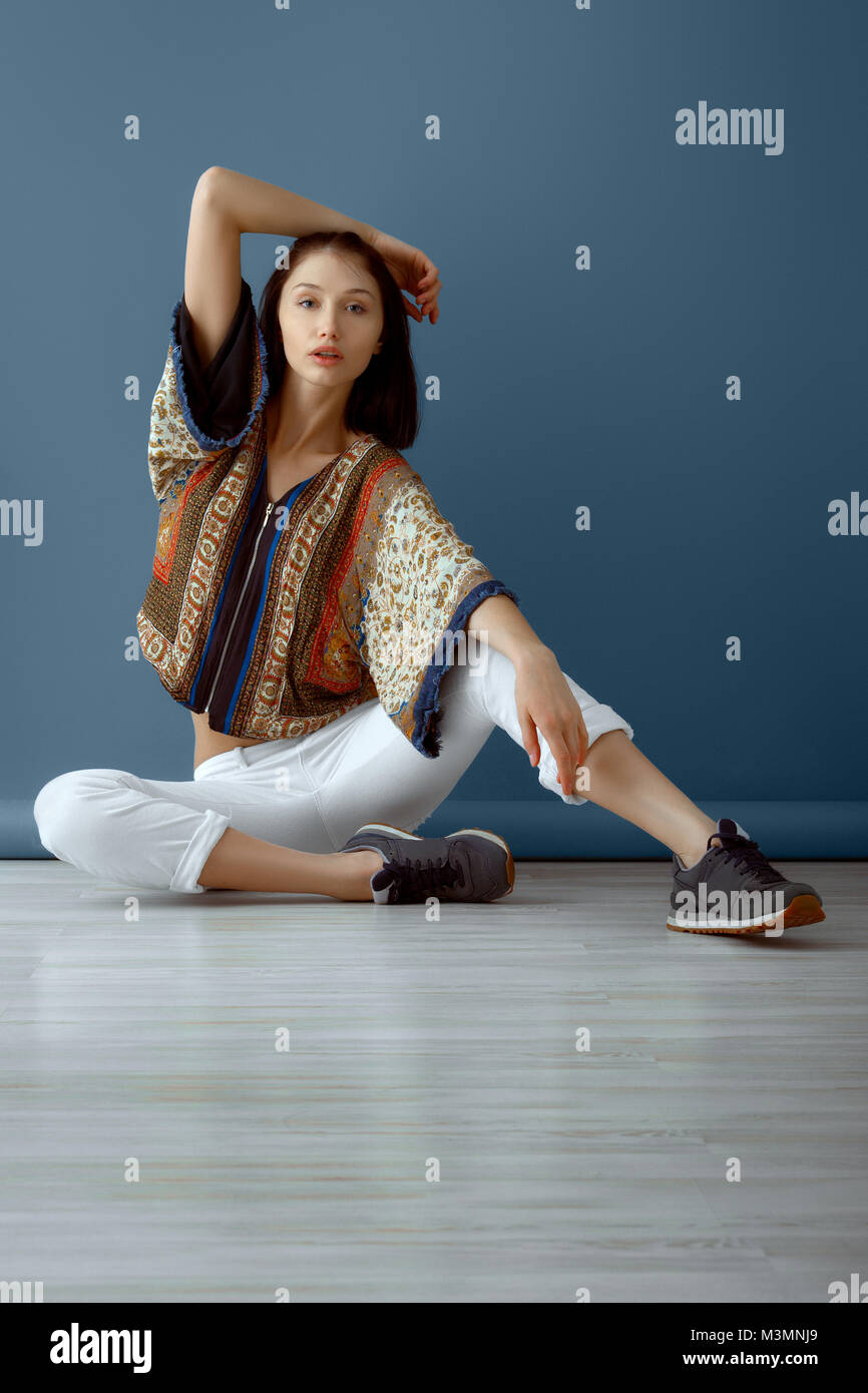 Calm hippie girl sitting on the floor Stock Photo