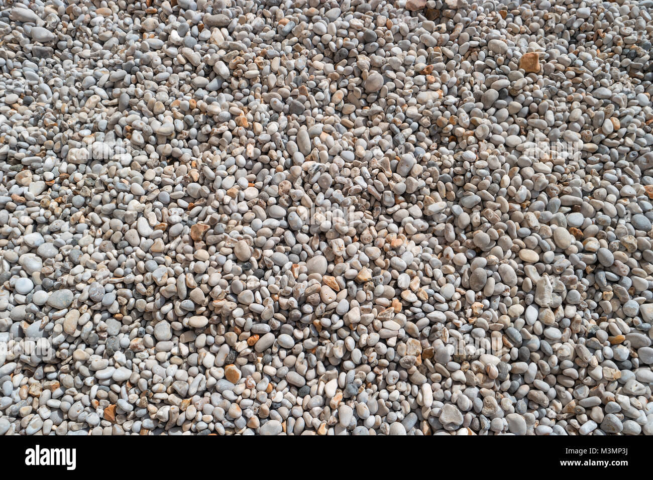 Pebbles on the beach for texture and background. Sea stones, Atlantic coast, Etretat, Normandy, France, Europe. Beautiful round sea pebbles on pebble  Stock Photo