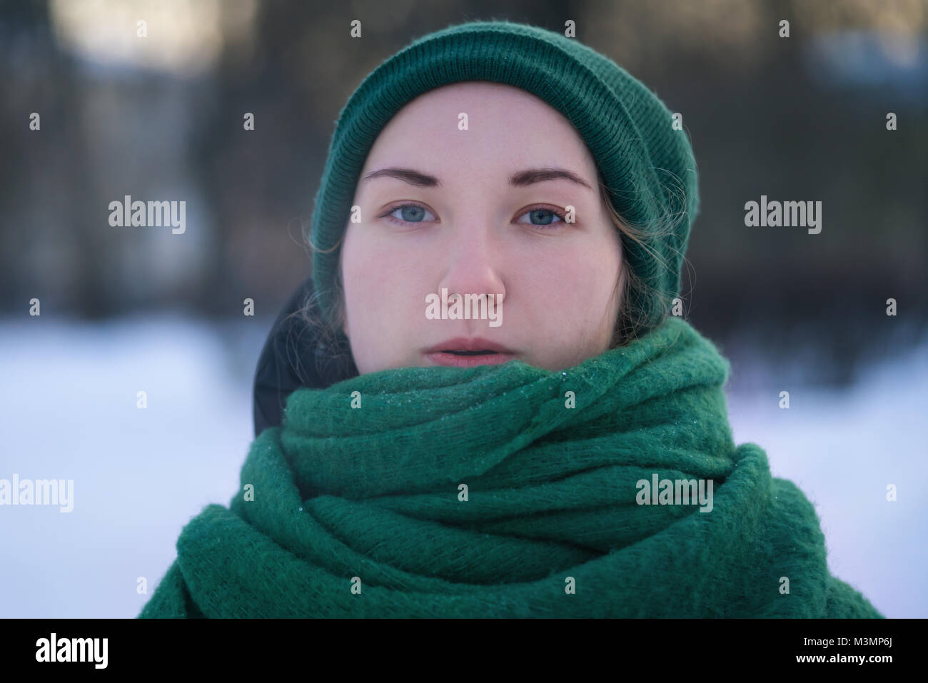 Teen girl breath out steam in cold winter day Stock Photo