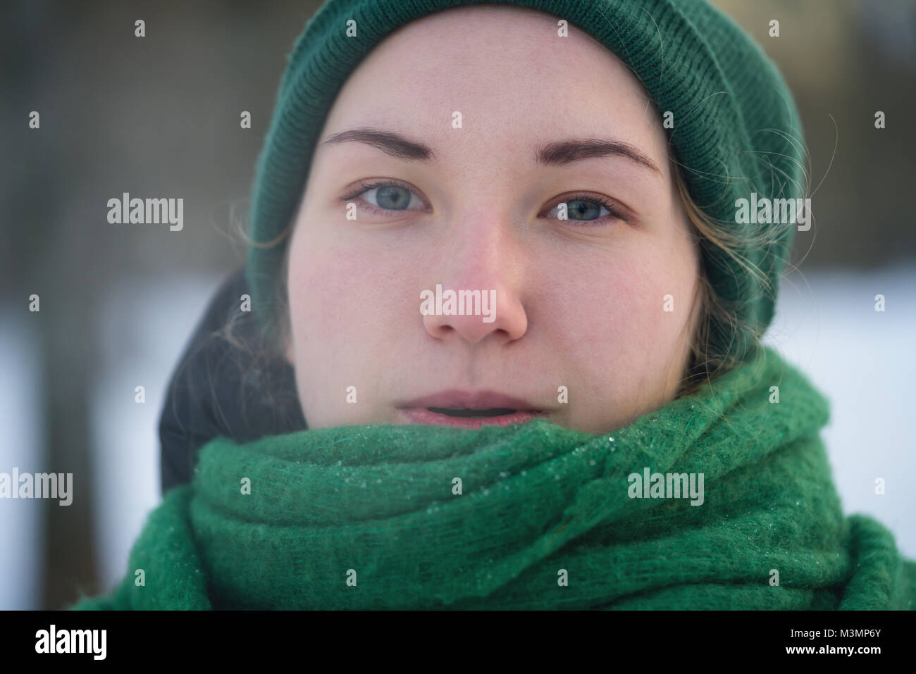 Teen girl breath out steam in cold winter day Stock Photo