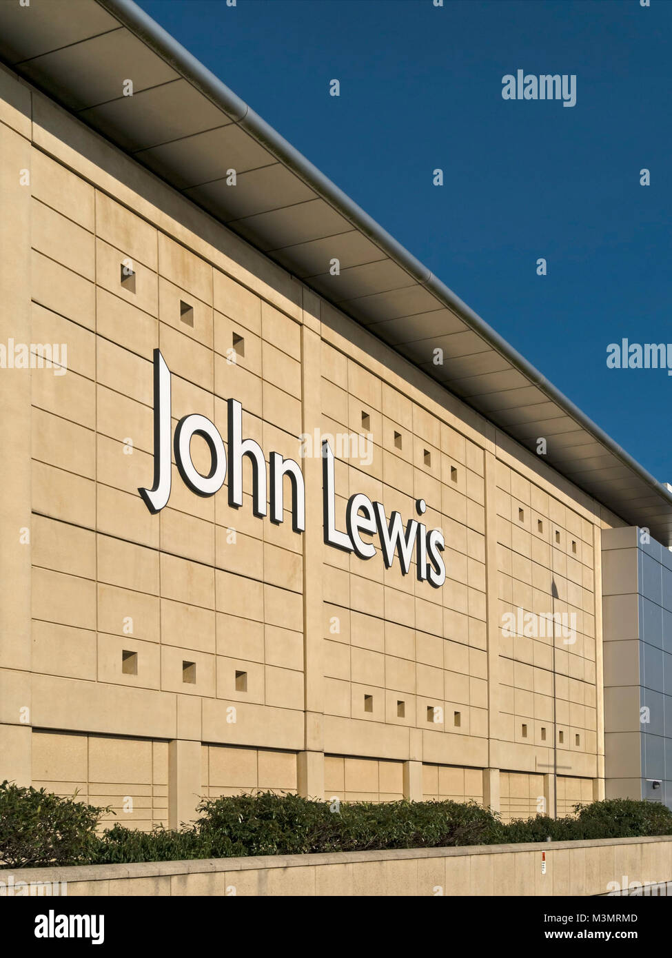 Large white John Lewis shop trademark logo on exterior wall of The Mall at Cribbs Causeway, Bristol, England, UK Stock Photo