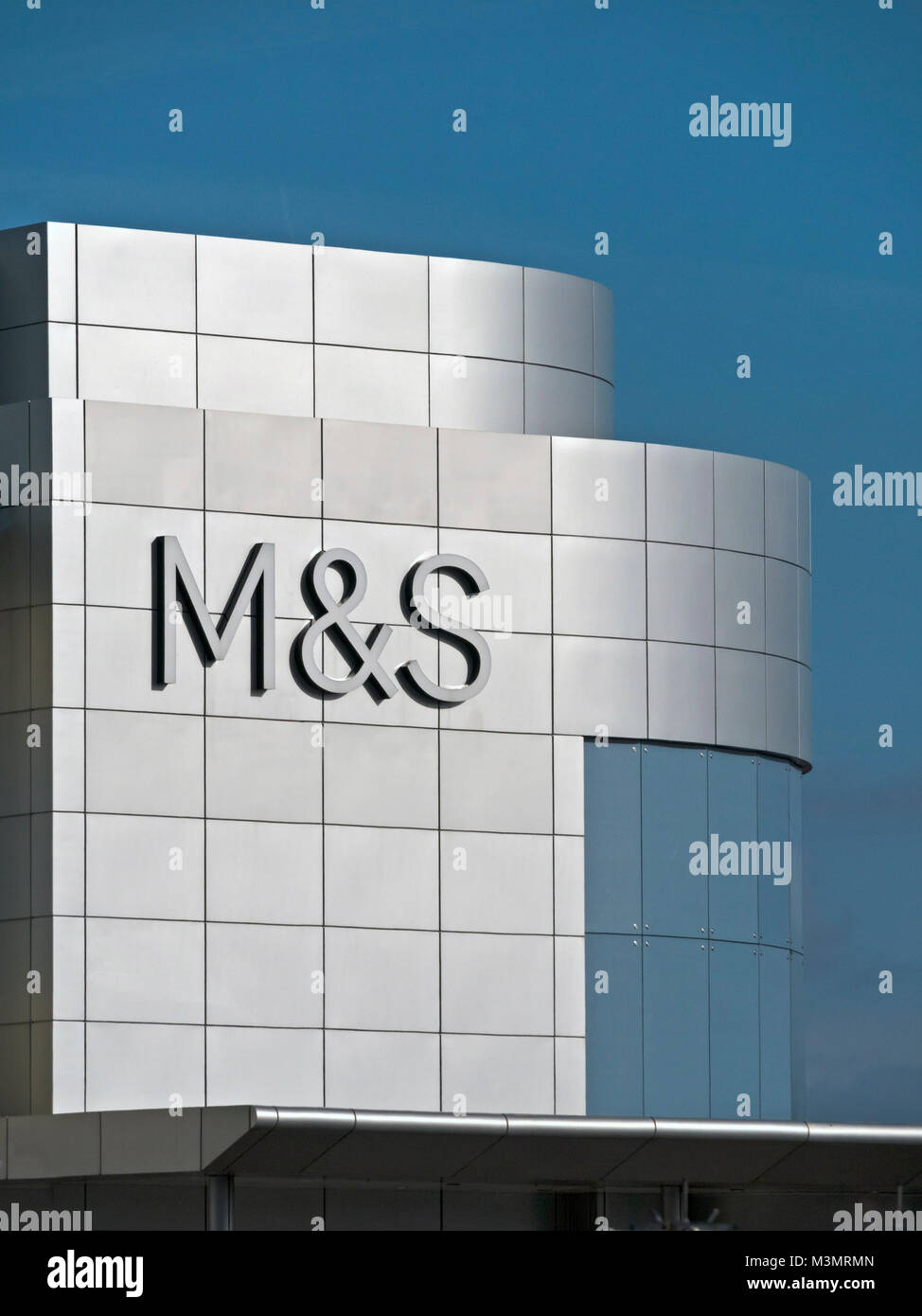 New Marks and Spencer (M&S) logo sign on stainless steel sidings above store at The Mall, Cribbs Causeway, Bristol, England, UK Stock Photo