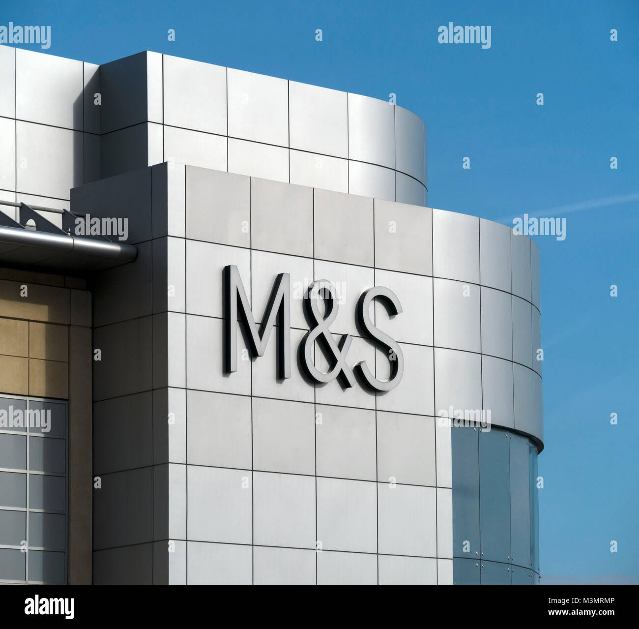 New Marks and Spencer (M&S) logo sign on stainless steel sidings above store at The Mall, Cribbs Causeway, Bristol, England, UK Stock Photo