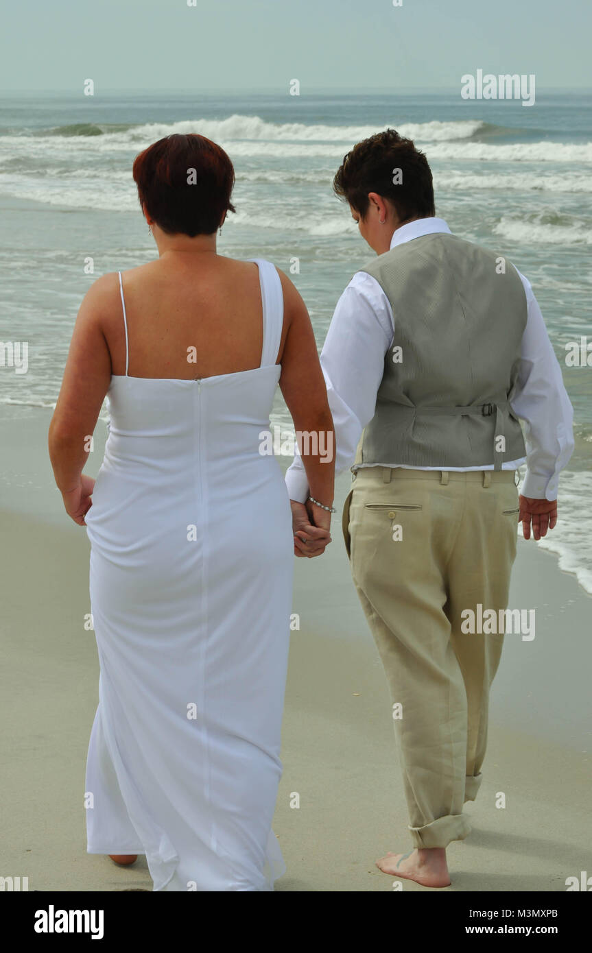 Married wedding couple walking away hi-res stock photography and images ...