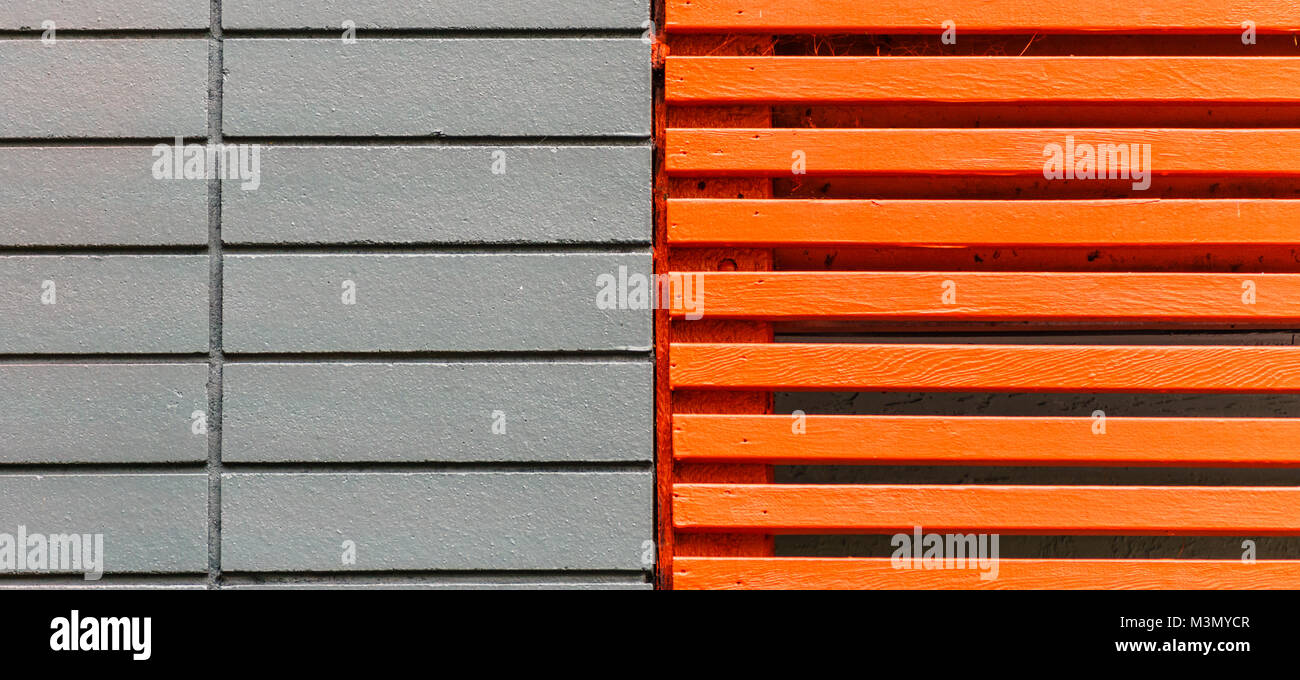 Colorful grey and orange wooden wall as background or texture. Stock Photo