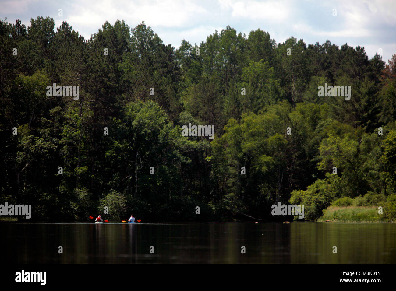 Kayakers on the Namekogan River between Howell Landing and Riverside Landing.  The Namekogan is part of the St. Croix National Scenic Waterway.  The p Stock Photo