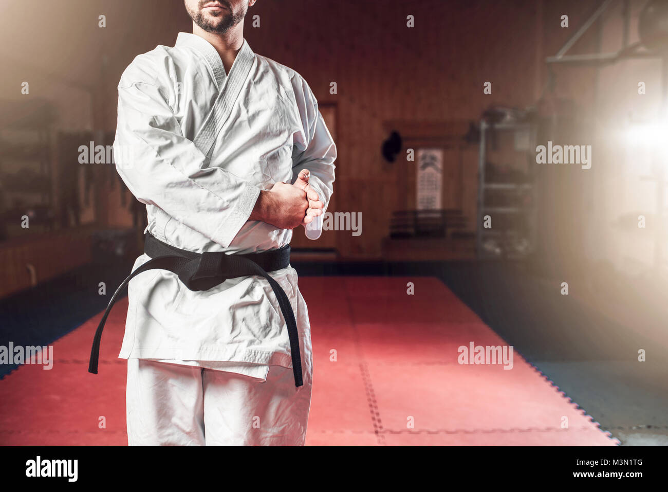 A Man, In A Black Kimono Is Practicing Martial Arts Technique With A Long  Bamboo Fighting Stick. Stock Photo, Picture and Royalty Free Image. Image  91980191.