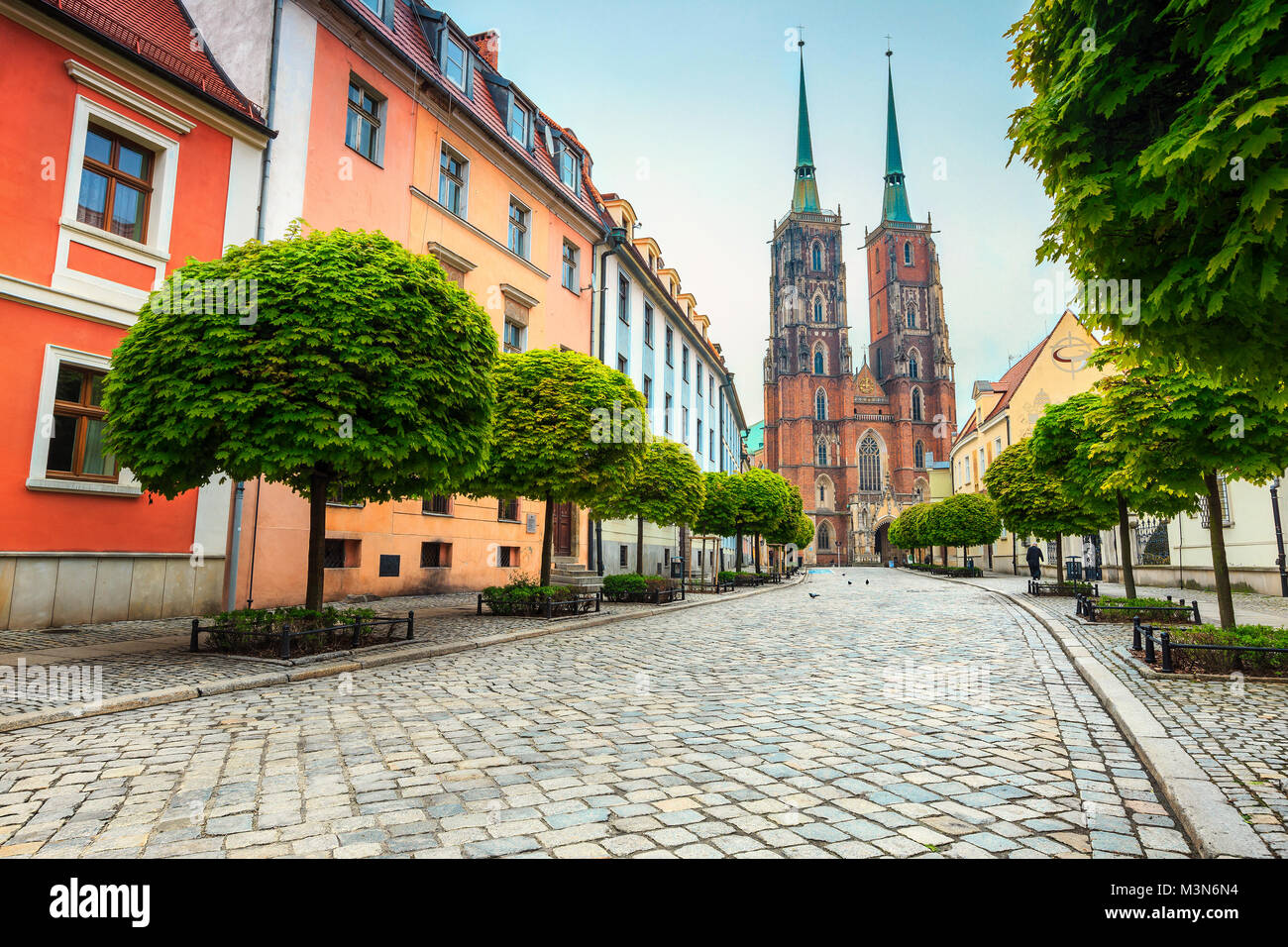 Fantastic spring street panorama with old buildings, paved road and spectacular St John cathedral, Wroclaw, Silesian Lowland region, Poland, Europe Stock Photo