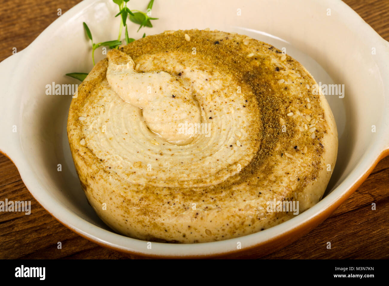 Vegetarian Humus with sesame seeds and thyme leaves Stock Photo Alamy