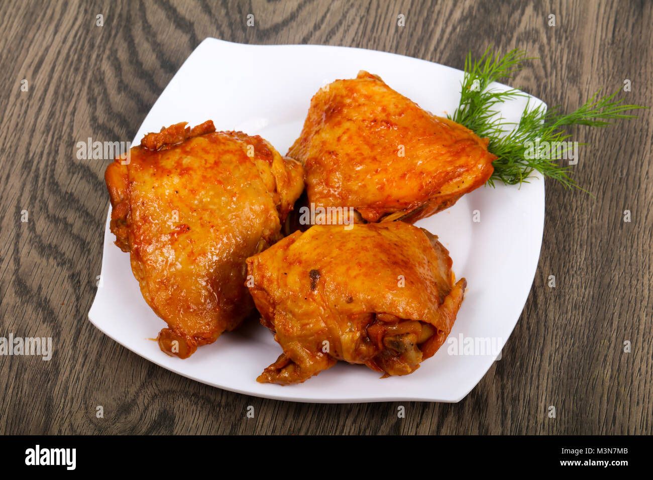 Roasted chicken thigh with tomato sauce Stock Photo Alamy