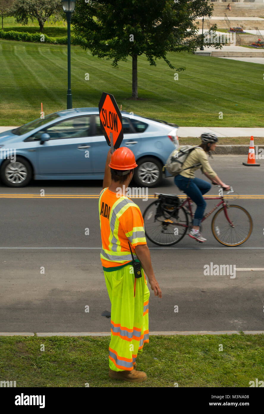 construction worker directing traffic Burlington Vermont Stock Photo