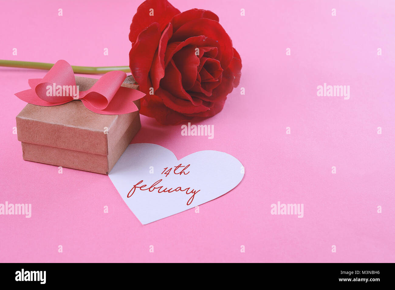 Gift box with red bow and valentines day card. Love concept. Pink ...