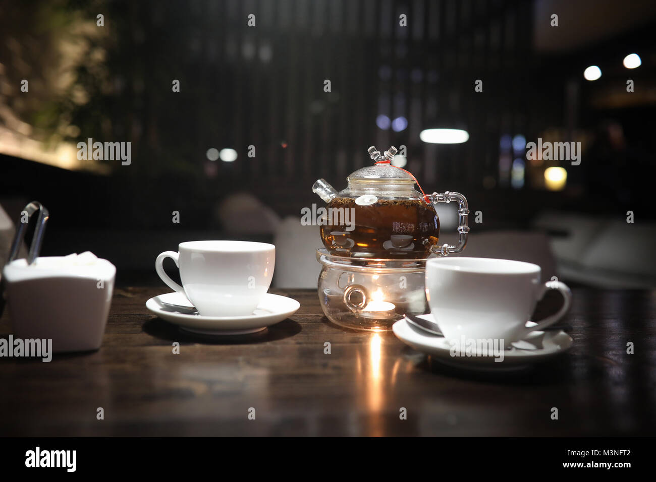 A table in a cafe with objects Stock Photo - Alamy