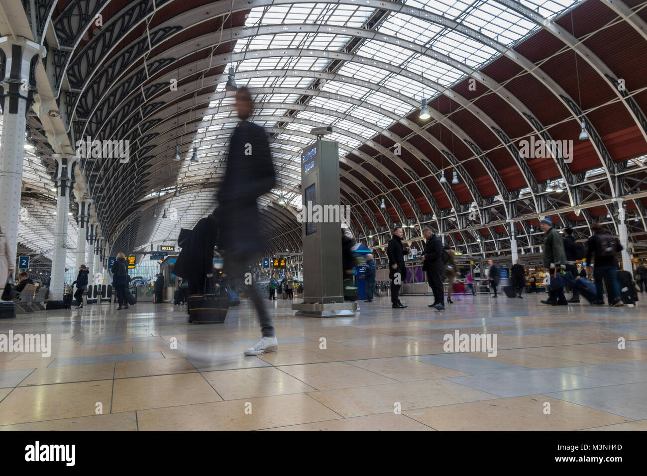 Commuters rushing to catch a train at Paddington station, London Stock Photo