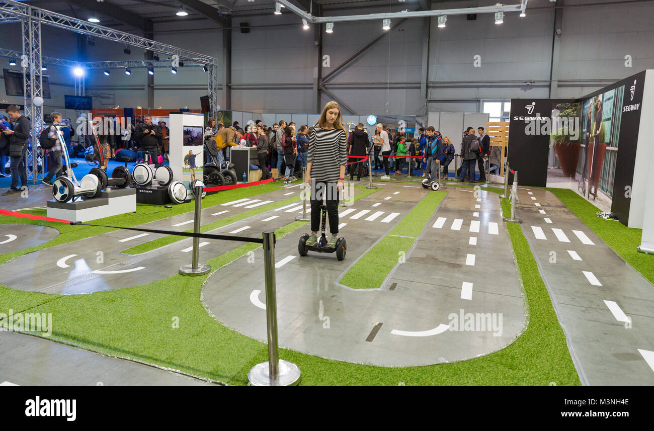 KIEV, UKRAINE - OCTOBER 07, 2017: People testing gyroscooters on Segway electric transport booth at the CEE 2017, the largest exhibition of consumer e Stock Photo